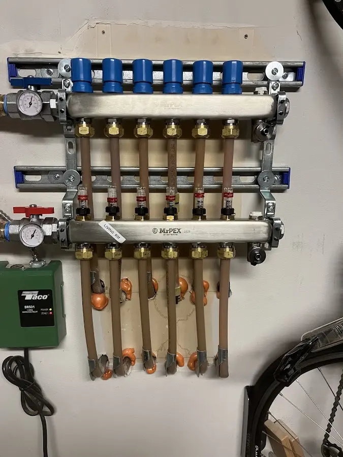 Plumber performing Water Heater Repair at a residential property in Norwell